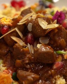 Ягненок с кускусом, зернами граната и миндалем